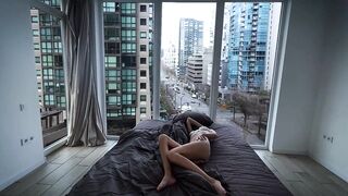 A fragile girl lays by the window and masturbates her holes in Vancouver center