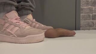 trampling in pink sneakers