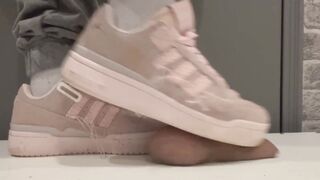 trampling in pink sneakers