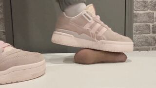 trampling in pink sneakers